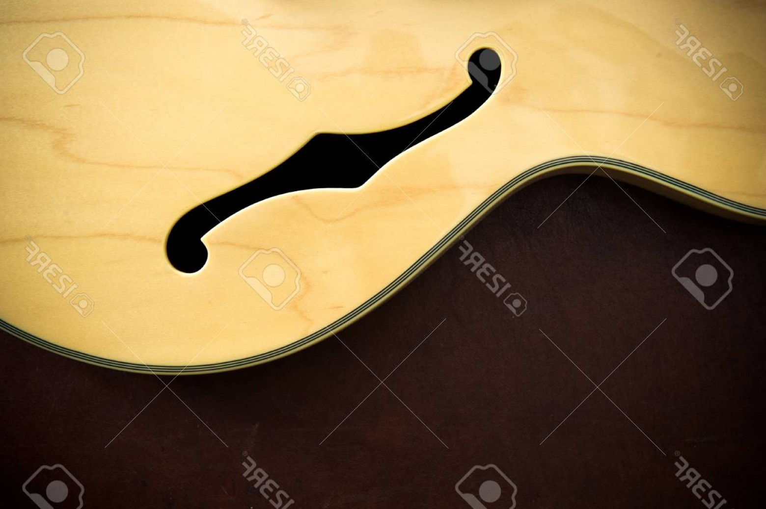 1560x1038 Photoguitar Body Detail With Sound F Hole On Wooden Background