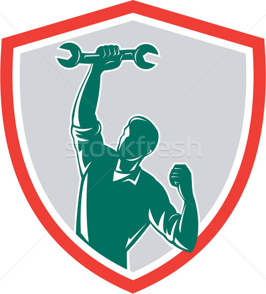 542x600 Mechanic Spanner Wrench Fist Pump Shield Vector Illustration