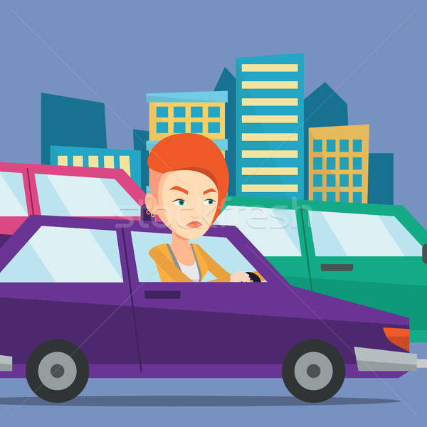 Angry Caucasian Female Car Driver Stuck In A Traffic Jam 600x600 Angry Caucasian Female Car Driver Stuck In A Traffic Jam