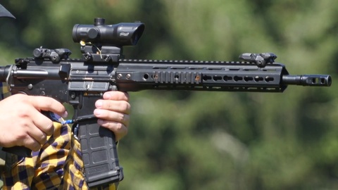 480x270 Man Shooting An Assault Weapon Fire With Fire Clip