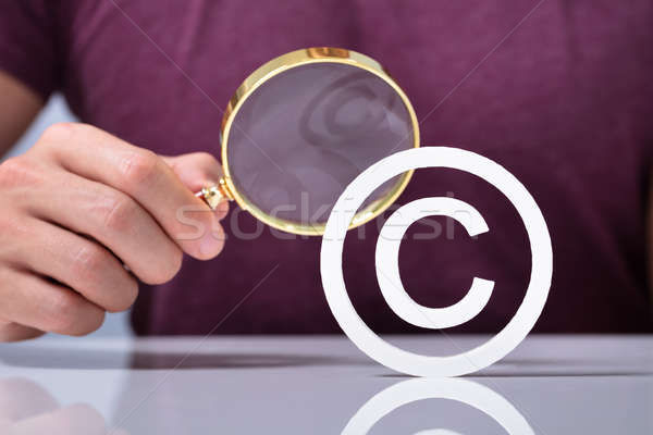 Magnifying Glass With White Copyright Symbol Icon Stock Photo 600x400 Magnifying Glass With White Copyright Symbol Icon Stock Photo