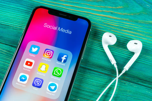 612x408 Apple Iphone X On Office Desk With Icons Of Social Media