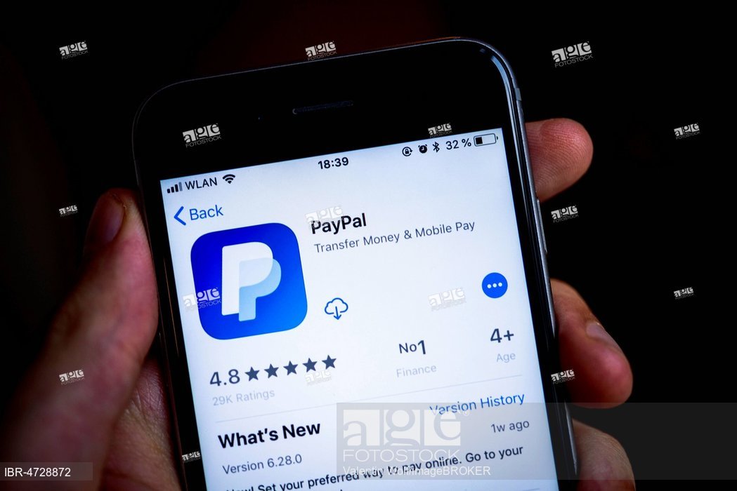 1049x700 Hand Holding Iphone, Amazon Paypal App In The Apple App Store