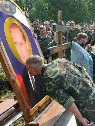 317x418 Russian Soldiers Worshipping An Icon Of Vladimir Putin Before