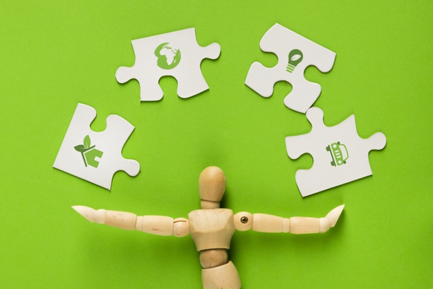 626x417 Ecology Icon On White Puzzle Pieces With Human Finger Over Green