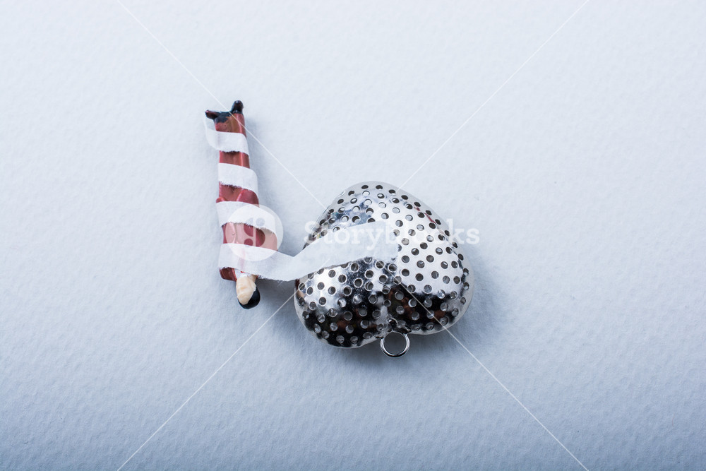 1000x667 Tiny Manwrapped In Bandages Attached To A Heart Icon Royalty Free